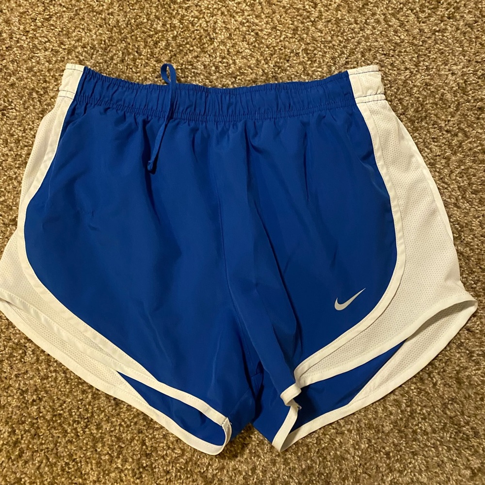 Blue and white Nike running shorts. Size S